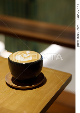 Cup of hot milk piccolo latte coffee on table. Cup of hot milk piccolo latte coffee on table. 138527464