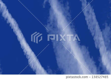 Traces airplane blue sky clouds background abstract lines stripes pattern 138527485