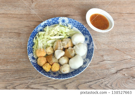 steamed fish and shrimp meatball with chop cabbage on plate dipping Thai spicy chili seafood sauce steamed fish and shrimp meatball with chop cabbage on plate dipping Thai spicy chili seafood sauce 138527663