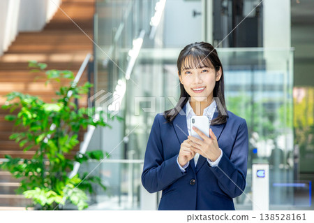 Young business woman with smartphone Young business woman with smartphone 138528161