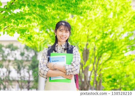Female college student walking on campus Female college student walking on campus 138528210