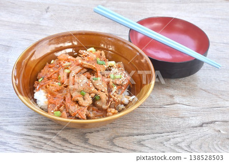 fried slice fermenting pork meat with spicy Japanese sauce topping white sesame and pickled ginger on plain rice in bowl fried slice fermenting pork meat with spicy Japanese sauce topping white sesame and pickled ginger on plain rice in bowl 138528503