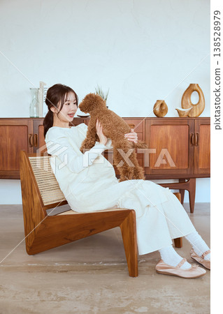 A woman and her toy poodle: A natural lifestyle with her pet. 138528979
