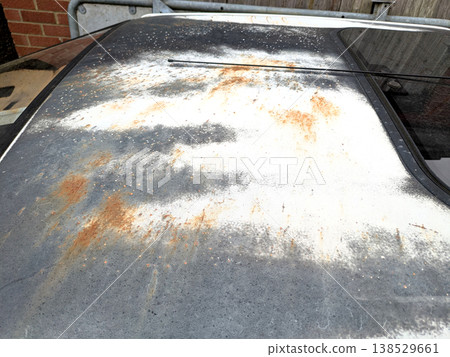 A rusted vintage car being abandoned on a street with flat tires and rusty bodywork A rusted vintage car being abandoned on a street with flat tires and rusty bodywork 138529661
