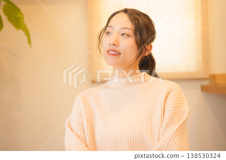 Daughter prays for the deceased at home. 138530324