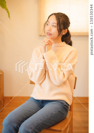 Daughter prays for the deceased at home. Daughter prays for the deceased at home. 138530344