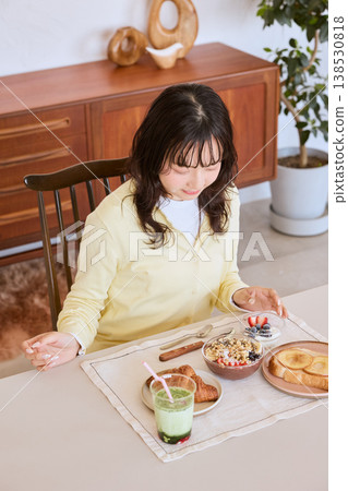 A young woman's lifestyle enjoying a healthy breakfast A young woman's lifestyle enjoying a healthy breakfast 138530818