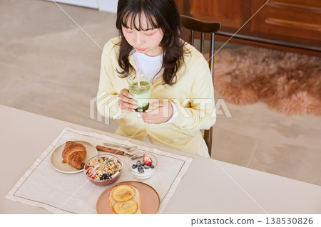 A young woman's lifestyle enjoying a healthy breakfast A young woman's lifestyle enjoying a healthy breakfast 138530826