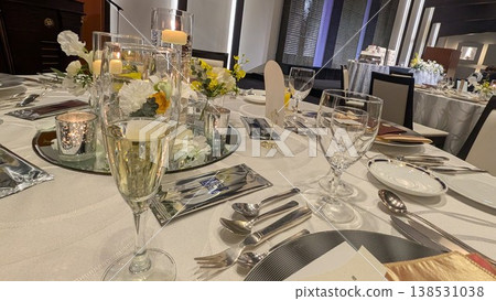 Wedding reception table setting and floral arrangements Wedding reception table setting and floral arrangements 138531038