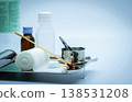 Wound care dressing set on stainless steel plate. Cotton ball with alcohol, cotton stick with povidone-iodine, forceps and conform bandage. Wound care dressing set on stainless steel plate. Cotton ball with alcohol, cotton stick with povidone-iodine, forceps and conform bandage. 138531208