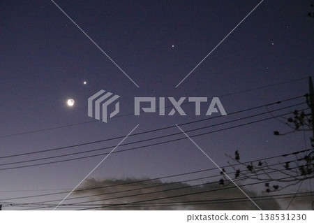 Moon and the moon floating in the night sky Moon and the moon floating in the night sky 138531230