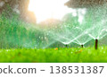 Automatic lawn sprinkler watering green grass. Sprinkler with automatic system. Garden irrigation system watering lawn. Water saving or water conservation from sprinkler system with adjustable head. Automatic lawn sprinkler watering green grass. Sprinkler with automatic system. Garden irrigation system watering lawn. Water saving or water conservation from sprinkler system with adjustable head. 138531387