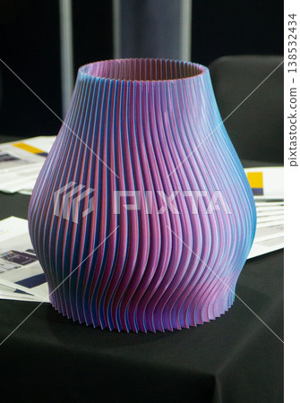 3D printed art object. Art object printed on 3D printer from melted colored plastic. Model in shape vase created on 3D printer from threads of molten plastic. Modern additive progressive technologies 3D printed art object. Art object printed on 3D printer from melted colored plastic. Model in shape vase created on 3D printer from threads of molten plastic. Modern additive progressive technologies 138532434