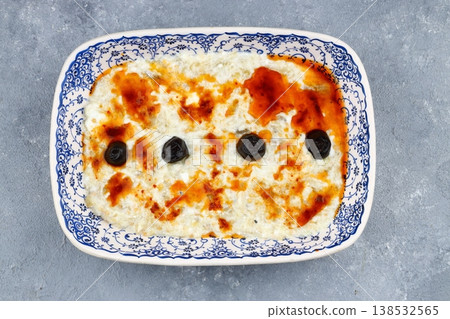 Smoky Roasted Eggplant Salad with Creamy Yogurt Sauce, Topped with Olives and Olive Oil Meze Appetizer 138532565