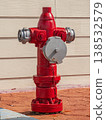 Red traditional fire hydrant on side walk, for 138532579