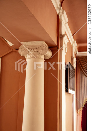 Decorative white column as a feature in a grand interior room. Neoclassical architectural Decorative white column as a feature in a grand interior room. Neoclassical architectural 138532679