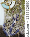 Decorative lifebuoy and anchor with shells on a fishing net. Blue life ring and white anchor  138532690