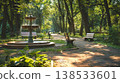 Tranquil City Park Scene with Fountain and Benches in Sunlit Forested Area. Concept of Urban Nature, Peaceful Getaway, Relaxation, and Outdoor Serenity 138533601