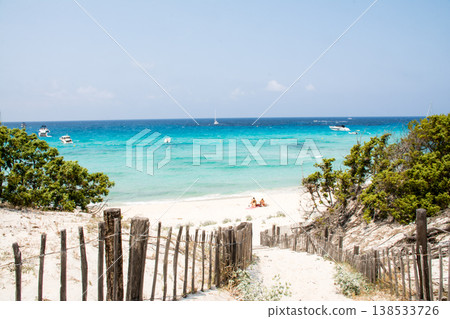 A leisure boat floats on the beautiful emerald green sea at Corsica, a French territory in the Mediterranean Sea. 138533726