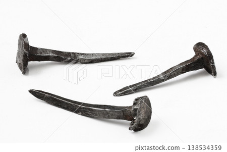 Unique set of ancient iron nails showcases craftsmanship from forgotten times in a minimalist display Unique set of ancient iron nails showcases craftsmanship from forgotten times in a minimalist display 138534359