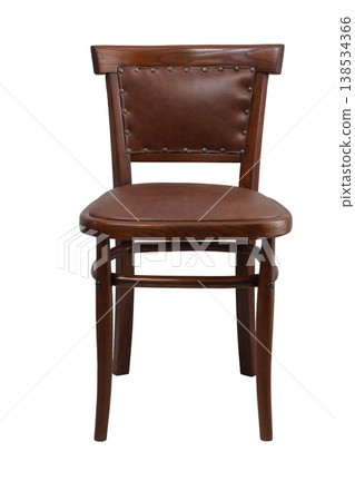 Discovering the elegance of simple design in a vintage wooden dining chair with a leather seat and studded backrest 138534366