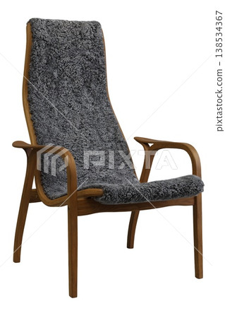 Mid-century modern chair design with cozy gray upholstery adds warmth to a stylish living room setting 138534367