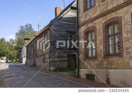 Charming streets of Cesis Latvia reveal a blend of history and nature on a bright, sunny day filled with serene moments 138534385