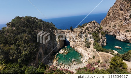Rocky sea arch. A stunning view of the seashore. Rocky arch flowers. High quality 4k footage 138534617