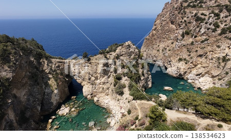 Rocky sea arch. A stunning view of the seashore. Rocky arch flowers. High quality 4k footage 138534623