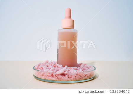 Cosmetic innovations combining serum dropper bottle and pink salt scrub Cosmetic innovations combining serum dropper bottle and pink salt scrub 138534942