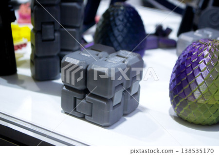 3D printed art object. Art object printed on 3D printer from melted black plastic. Model in shape cube created on 3D printer from threads of molten plastic. Modern additive progressive technologies 3D printed art object. Art object printed on 3D printer from melted black plastic. Model in shape cube created on 3D printer from threads of molten plastic. Modern additive progressive technologies 138535170