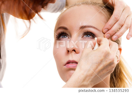 Makeup artist apply make up 138535293