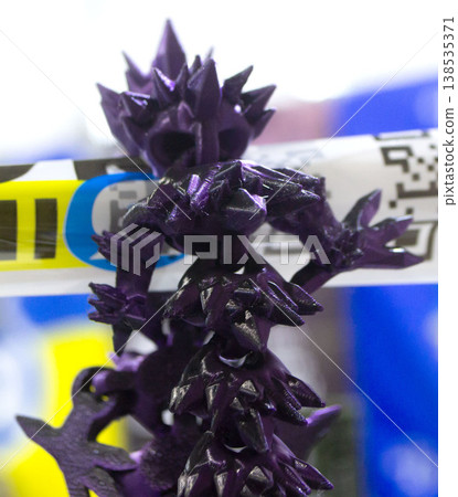 3D printed art object. Object printed on 3D printer from melted colored purple plastic. Model created on 3D printer from threads of molten plastic. Modern new additive progressive printing technology 3D printed art object. Object printed on 3D printer from melted colored purple plastic. Model created on 3D printer from threads of molten plastic. Modern new additive progressive printing technology 138535371