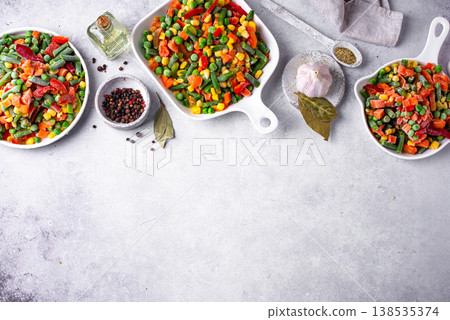 Frozen mix of vegetables on dark background Frozen mix of vegetables on dark background 138535374