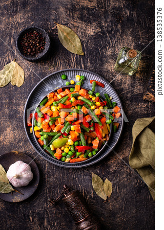 Frozen mix of vegetables on dark background 138535376