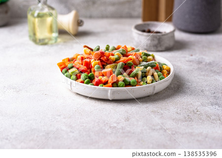 Frozen mix of vegetables on dark background Frozen mix of vegetables on dark background 138535396