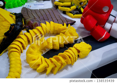 3D printed many different art objects. Objects printed on 3D printer from melted colored plastic. Models created on 3D printer from threads of molten plastic. Modern additive progressive technologies 138535439