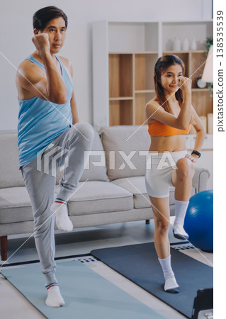 Support, teamwork and fitness couple doing workout training, challenging exercise for endurance, strength and stamina in a gym. Active, fit man and woman giving support and motivation during pushup Support, teamwork and fitness couple doing workout training, challenging exercise for endurance, strength and stamina in a gym. Active, fit man and woman giving support and motivation during pushup 138535539