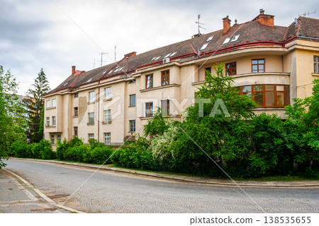 uzhhorod, ukraine - 03 jun 2012: urban scenery in summertime. view from hoidy street near park of st. tetyany with paved walkways. location near narodna square. cobbled street of uzhgorod city uzhhorod, ukraine - 03 jun 2012: urban scenery in summertime. view from hoidy street near park of st. tetyany with paved walkways. location near narodna square. cobbled street of uzhgorod city 138535655