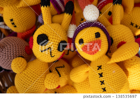 Handmade Crochet Plush Toys Colorful Amigurumi Dolls Close Up Background Handmade Crochet Plush Toys Colorful Amigurumi Dolls Close Up Background 138535697