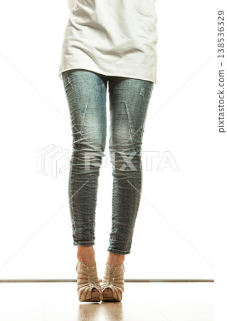 woman legs in denim trousers high heels shoes woman legs in denim trousers high heels shoes 138536329