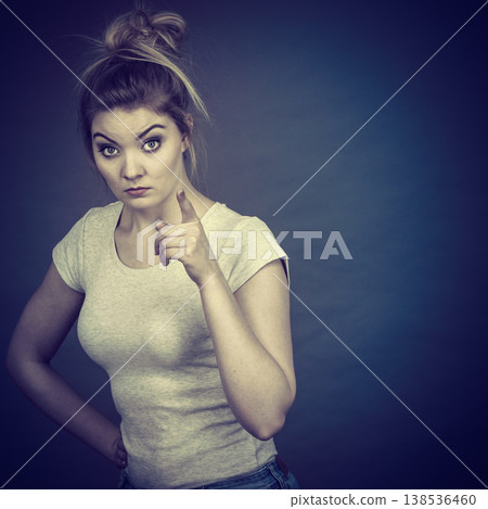 Woman wearing eyeglasses pointing at camera Woman wearing eyeglasses pointing at camera 138536460