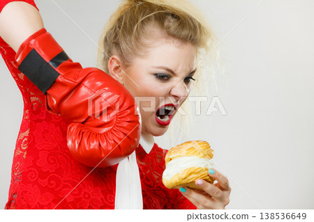 Woman boxing cream cupcake Woman boxing cream cupcake 138536649
