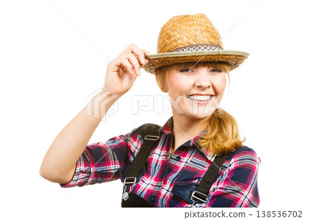 Portait smiling woman wearing sun hat and shirt 138536702