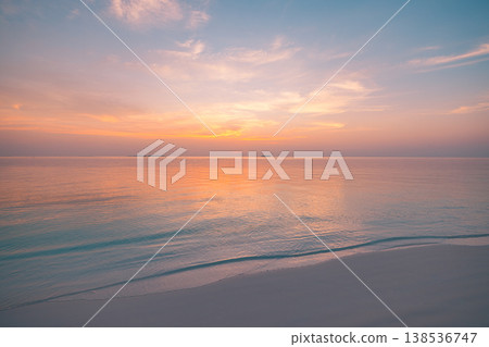 Tranquil sunset ocean surface with soft glowing horizon, inspirational summer seascape and colorful twilight sky Tranquil sunset ocean surface with soft glowing horizon, inspirational summer seascape and colorful twilight sky 138536747
