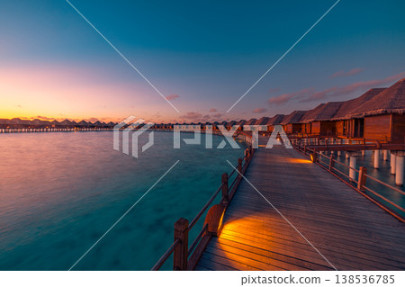 Breathtaking sunset water villas on dreamy pier with majestic ocean view, radiant luxury tourism destination background Breathtaking sunset water villas on dreamy pier with majestic ocean view, radiant luxury tourism destination background 138536785
