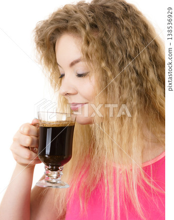 Positive woman drinking her morning coffee 138536929