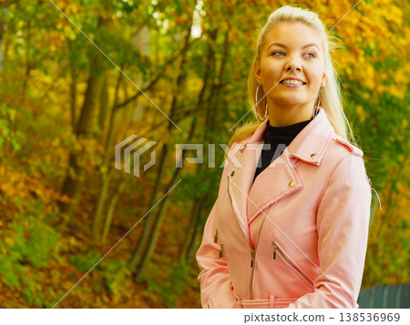 Fashion woman walking in autumn park Fashion woman walking in autumn park 138536969