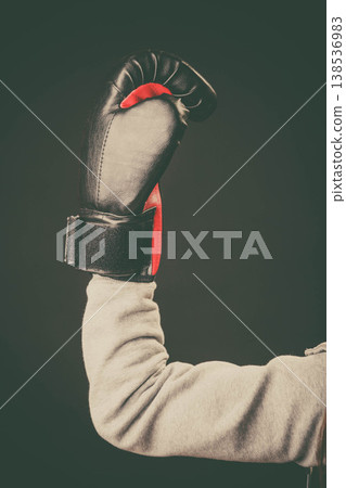Arm with boxing glove hold in air. Arm with boxing glove hold in air. 138536983