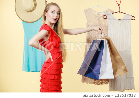 Woman in shop picking clothes, sale concept Woman in shop picking clothes, sale concept 138537038